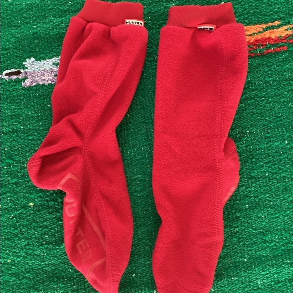 This is a pair of red Hunter Original Tall Fleece Welly Boot Socks.